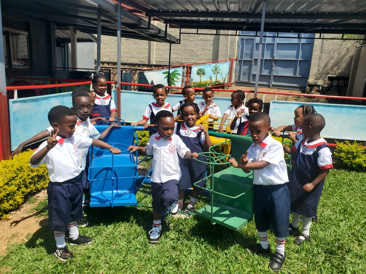 Nursery pupils in uniform on the playground